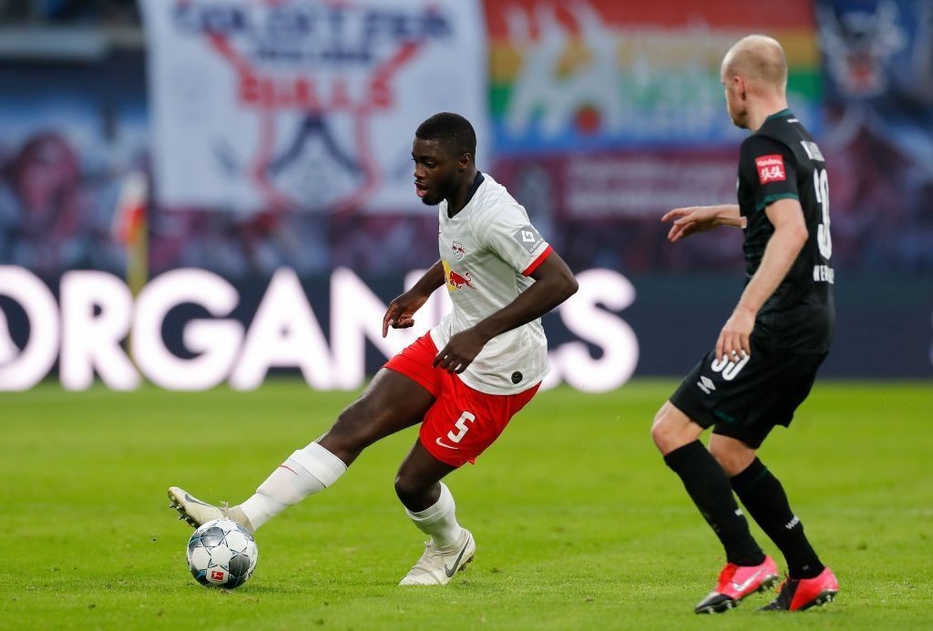 Leipzig's French defender Dayot Upamecano (L) and Bremen's Dutch defender Davy Klaassen vie for the ball during the German first division Bundeslig...