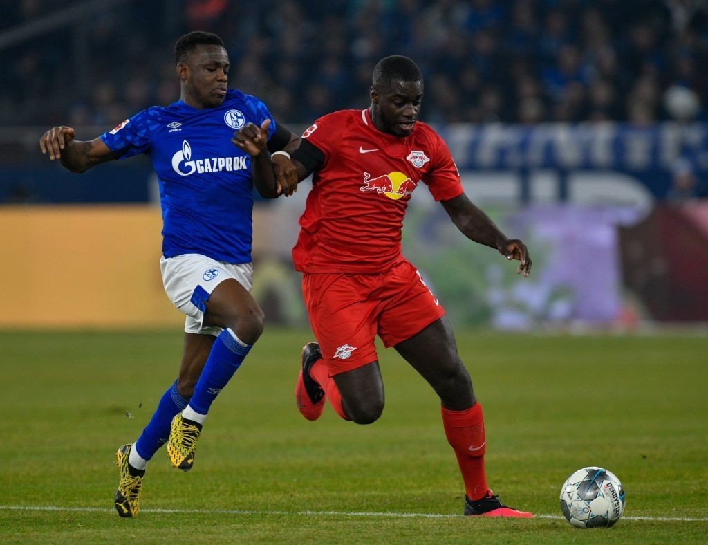 Schalke's Welsh forward Rabbi Matondo and Leipzig's French defender Dayot Upamecano vie for the ball during the German First division Bundesliga fo...
