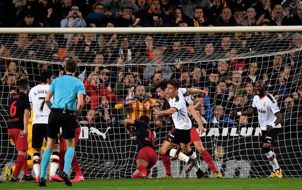 Valencia's Brazilian defender Gabriel Paulista (C) celebrates after scporing during the Spanish league football match between Valencia CF and Club Atletico de Madrid at the Mestalla stadium in Valencia on February 14, 2020. 