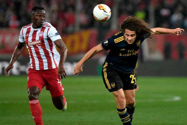 Arsenal's French midfielder Matteo Guendouzi (R) vies with Olympiakos' Guinean midfielder Mohamed Mady Camara (L) during the UEFA Europa League rou...