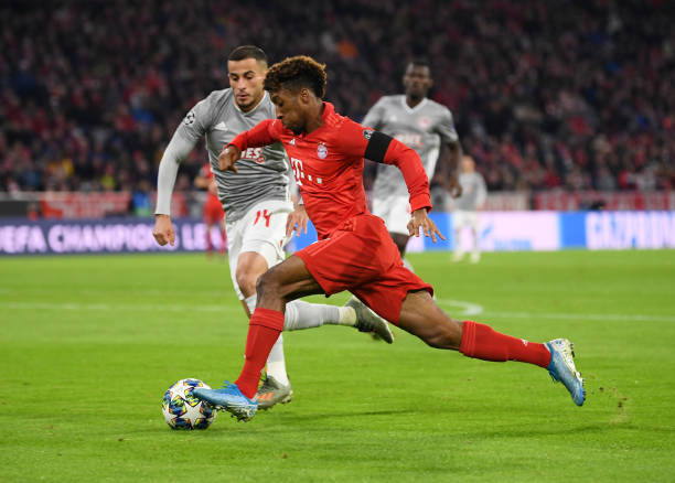 Kingsley Coman of FC Bayern Munich battles for possession with Omar Elabdellaoui of Olympiacos during the UEFA Champions League group B match betwe...