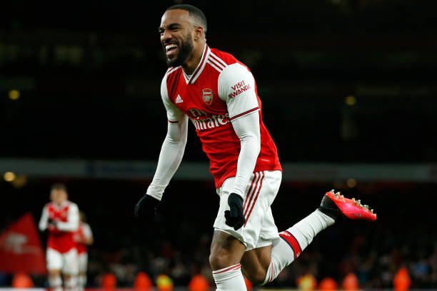 Arsenal's French striker Alexandre Lacazette celebrates after scoring their fourth goal during the English Premier League football match between Ar...