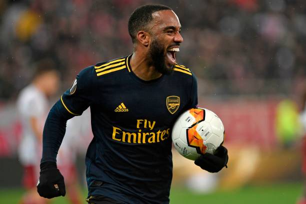 Arsenal's French striker Alexandre Lacazette celebrates after he scores the opening goal of the UEFA Europa League round of 32 first leg football match between Olympiakos and Arsenal at the Karaiskakis Stadium in Piraeus, near Athens, on February 20, 2020.