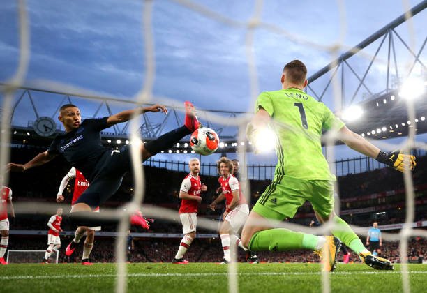 Richarlison of Everton scores his team's second goal past Bernd Leno of Arsenal during the Premier League match between Arsenal FC and Everton FC a...