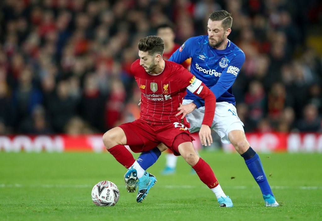 LIVERPOOL, ENGLAND - JANUARY 05: Adam Lallana of Liverpool battles for possession with Gylfi Sigurdsson of Everton during the FA Cup Third Round ma...