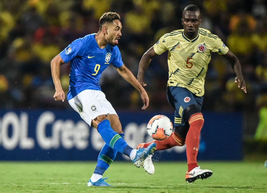 Brazilian forward Matheus Cunha (L) and Colombian midfielder Kevin Balanta vie for the ball during a Under-23 South American Pre-Olympic Tournament football match at Alfonso Lopez stadium, Bucaramanga, Colombia on February 3, 2020. (Photo by JUAN BARRETO/AFP via Getty Images)