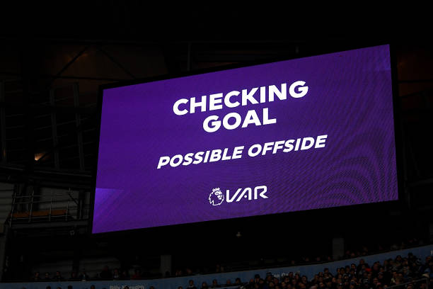 The Big screen shows the VAR check for a possible offside during the Premier League match between Manchester City and Sheffield United at Etihad St...
