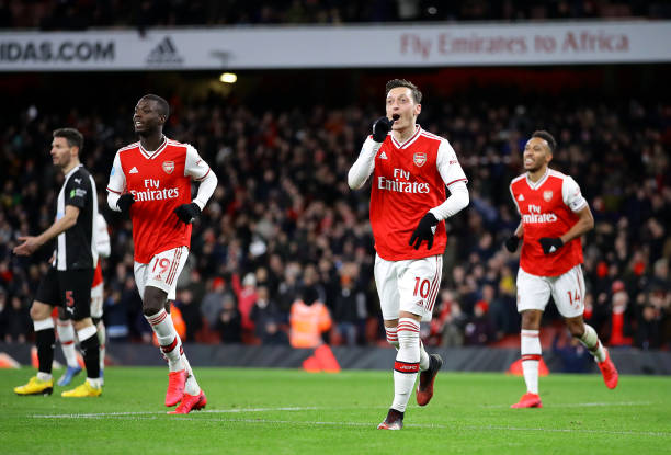 LONDON, ENGLAND - FEBRUARY 16: Mesut Ozil of Arsenal celebrates after scoring his sides third goal during the Premier League match between Arsenal FC and Newcastle United at Emirates Stadium on February 16, 2020 in London, United Kingdom. (Photo by Richard Heathcote/Getty Images)