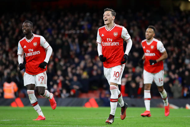 Mesut Ozil of Arsenal celebrates after scoring his sides third goal during the Premier League match between Arsenal FC and Newcastle United at Emir...
