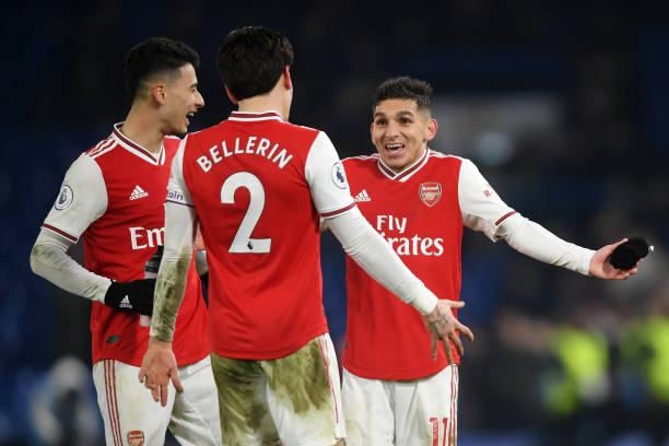 LONDON, ENGLAND - JANUARY 21: Hector Bellerin embraces Gabriel Martinelli and Lucas Torreira of Arsenal during the Premier League match between Che...
