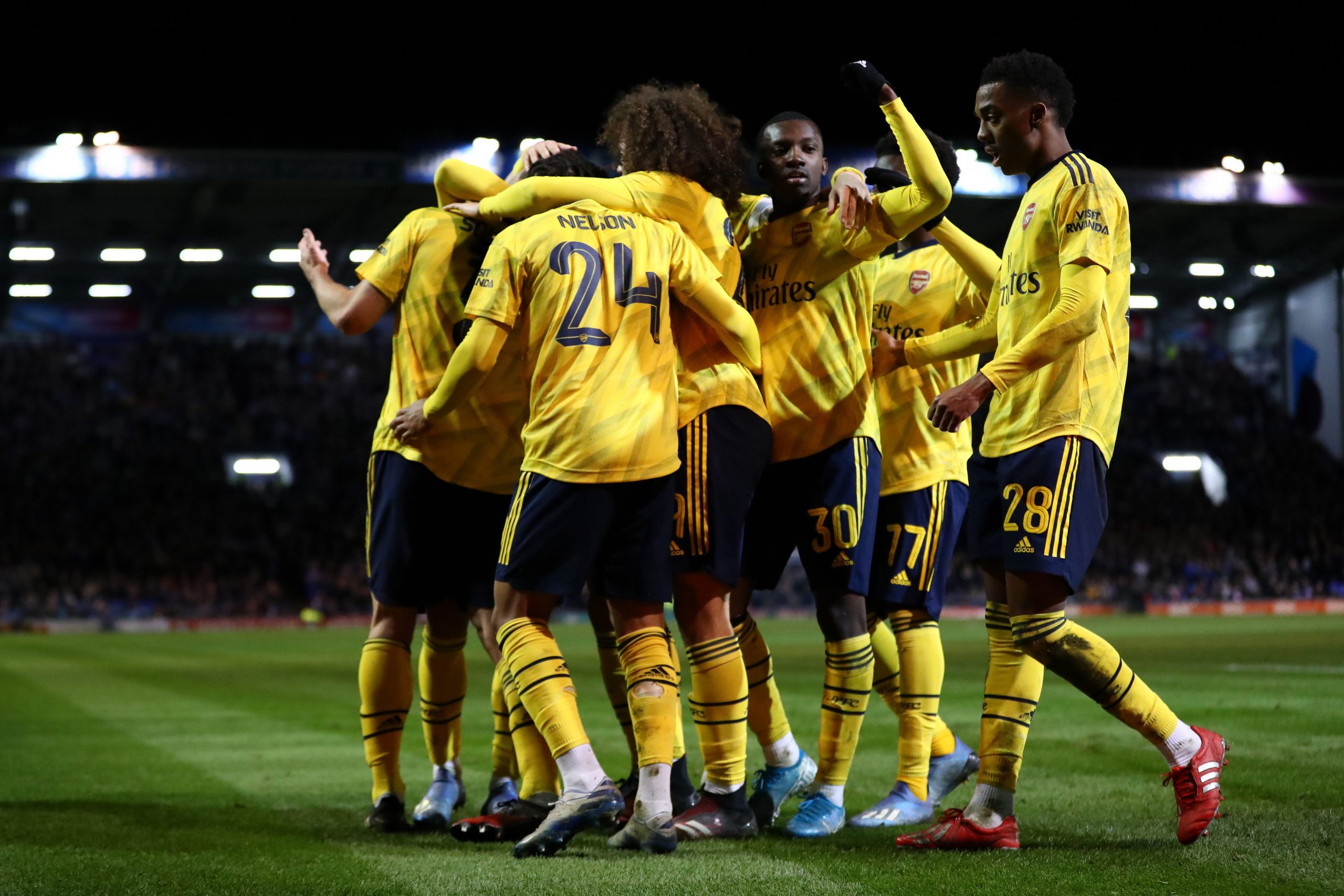 Sokratis Papastathopoulos of Arsenal celebrates with teammates after scoring their sides first goal during the FA Cup Fifth Round match between Por...