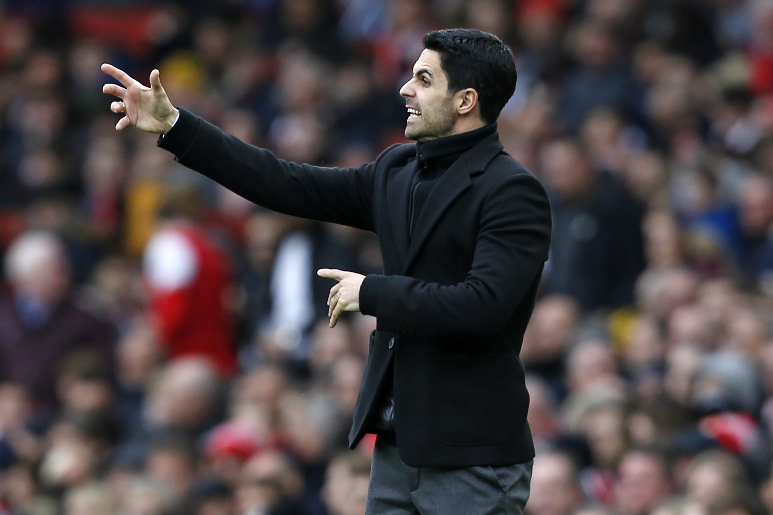 Arsenal's Spanish head coach Mikel Arteta gestures on the touchline during the English Premier League football match between Arsenal and West Ham a...