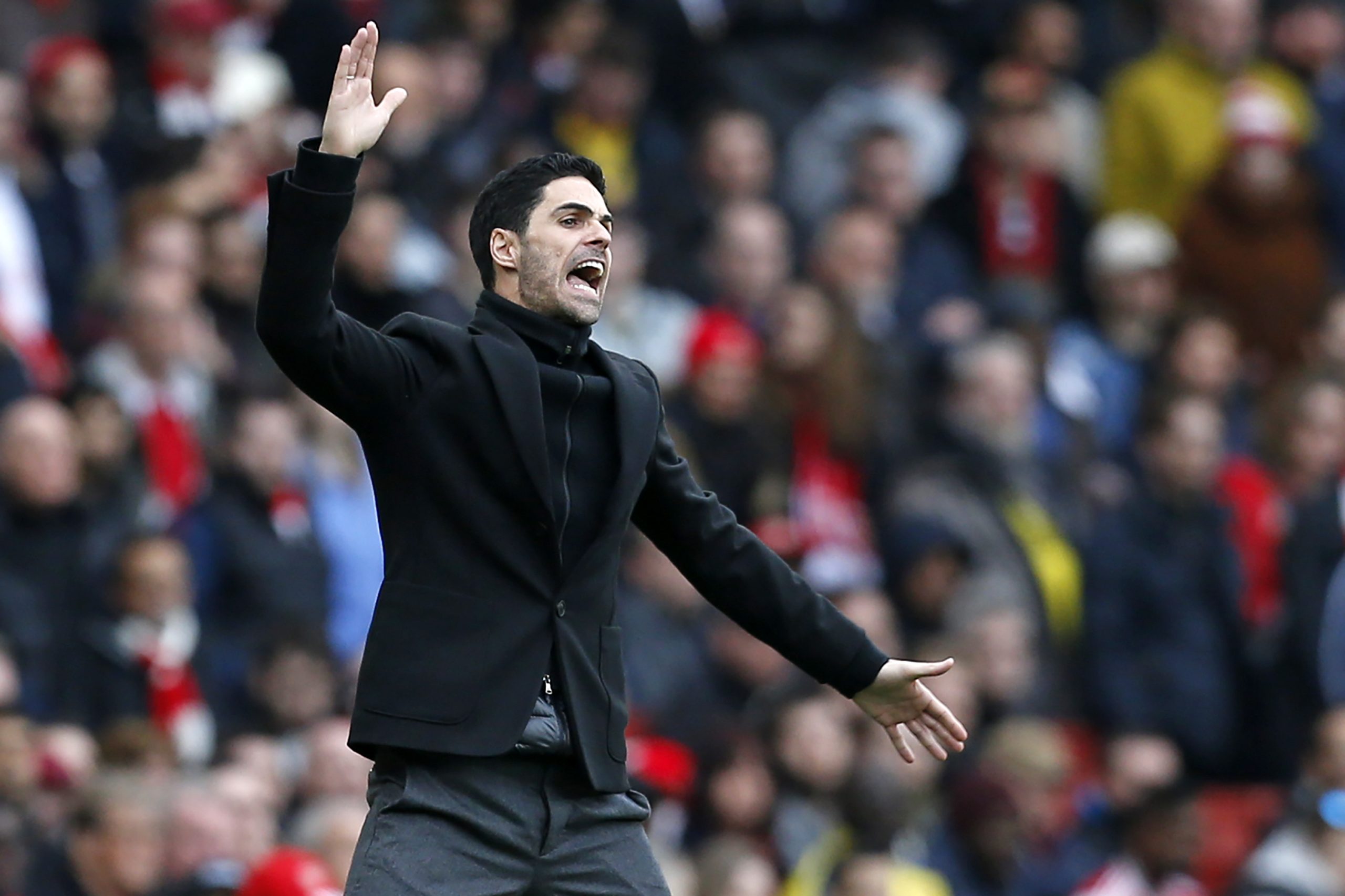 Arsenal's Spanish head coach Mikel Arteta gestures on the touchline during the English Premier League football match between Arsenal and West Ham a...