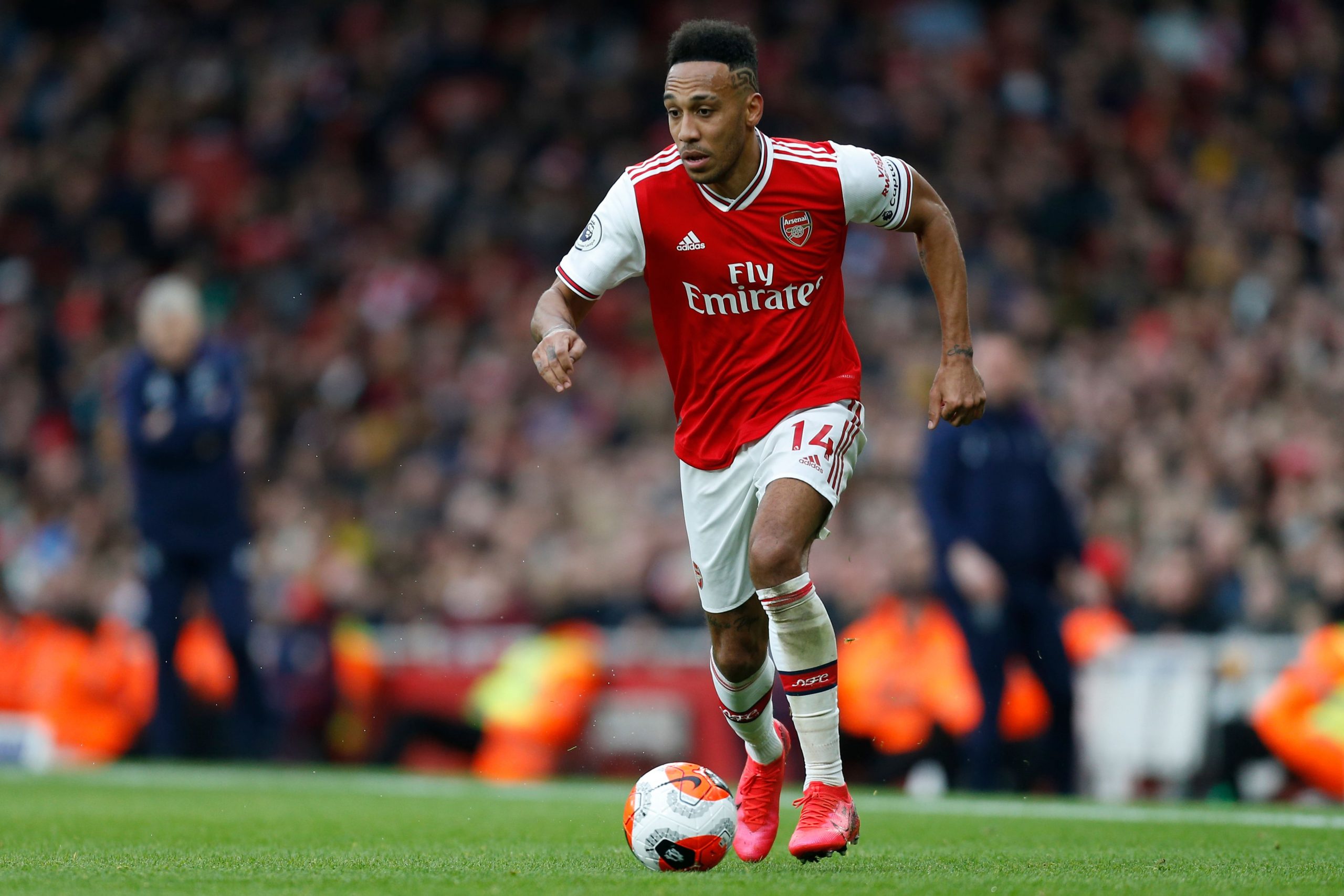 Arsenal's Gabonese striker Pierre-Emerick Aubameyang runs with the ball during the English Premier League football match between Arsenal and West H...
