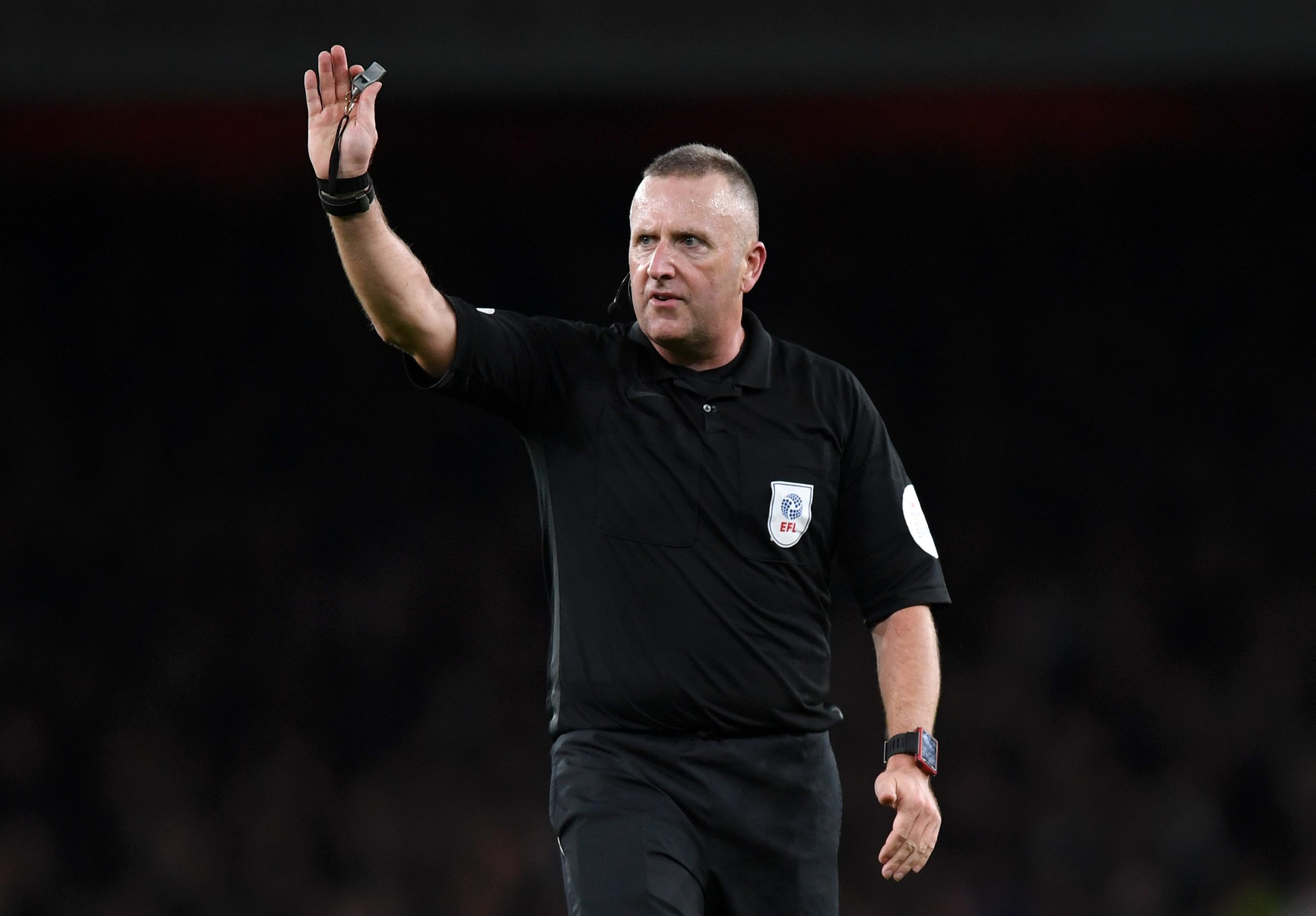 Match Referee Jonathan Moss gestures during the Carabao Cup Quarter Final match between Arsenal and Tottenham Hotspur at Emirates Stadium on Decemb...