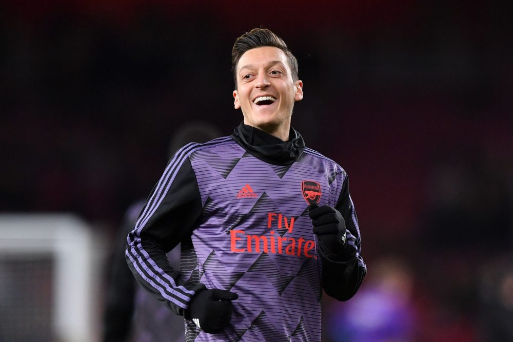 Arsenal's German midfielder Mesut Ozil warms up for the English Premier League football match between Arsenal and Manchester City at the Emirates Stadium in London on December 15, 2019.