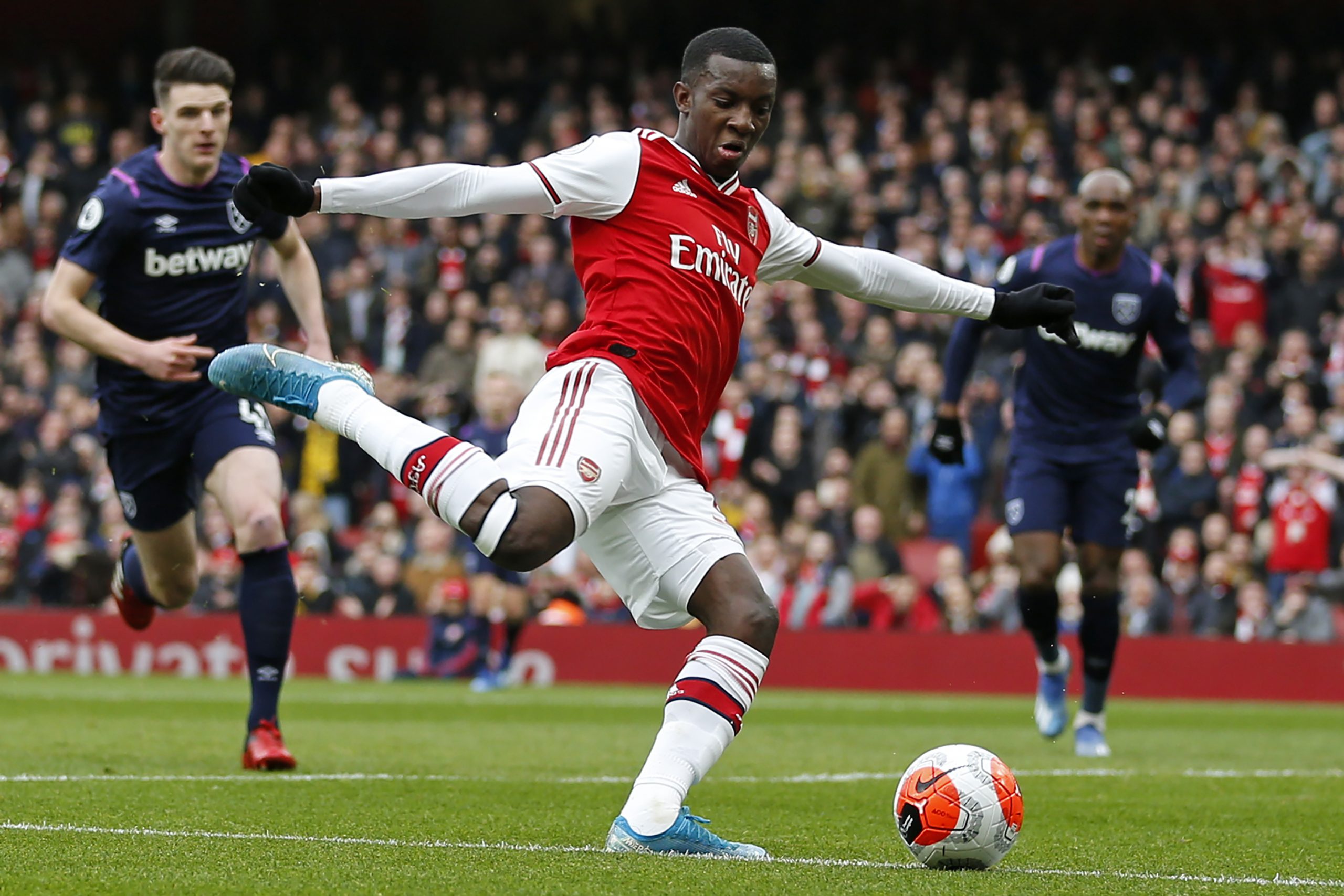 Arsenal's English striker Eddie Nketiah crosses the ball during the English Premier League football match between Arsenal and West Ham at the Emira...