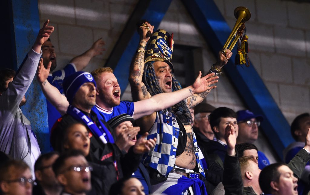Portsmouth plan to use crowd to beat Arsenal 2 Portsmouth fans sing during the Checkatrade Trophy match between Bury and Portsmouth at Gigg Lane on February 26, 2019 in Bury, England.