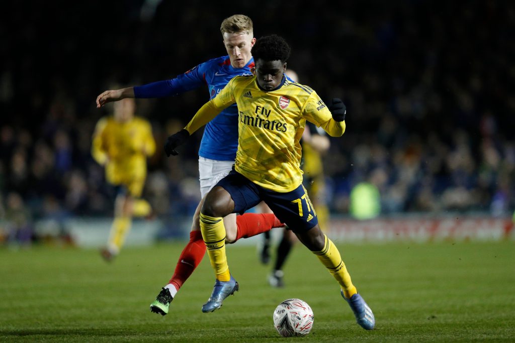 Arsenal now prioritising Saka contract extension talks 2 Arsenal's English striker Bukayo Saka (R) runs with the ball during the English FA Cup fifth round football match between Portsmouth and Arsenal at Fratton Park stadium in Portsmouth, southern England, on March 2, 2020.