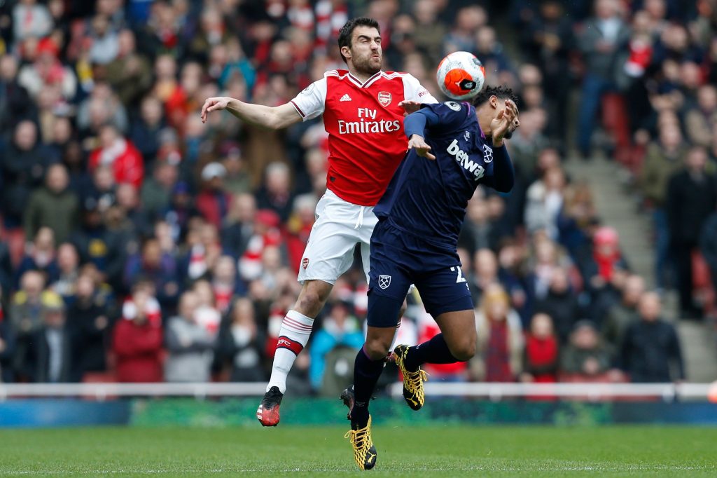 Arsenal's Greek defender Sokratis Papastathopoulos (L) vies with West Ham United's French striker Sebastien Haller (R) during the English Premier League football match between Arsenal and West Ham at the Emirates Stadium in London on March 7, 2020.