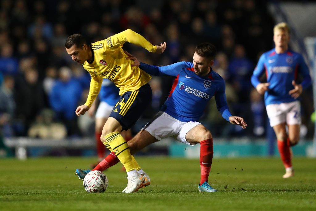 Granit Xhaka of Arsenal battles for possession with Ben Close of Portsmouth FC during the FA Cup Fifth Round match between Portsmouth FC and Arsenal FC at Fratton Park on March 02, 2020 in Portsmouth, England.