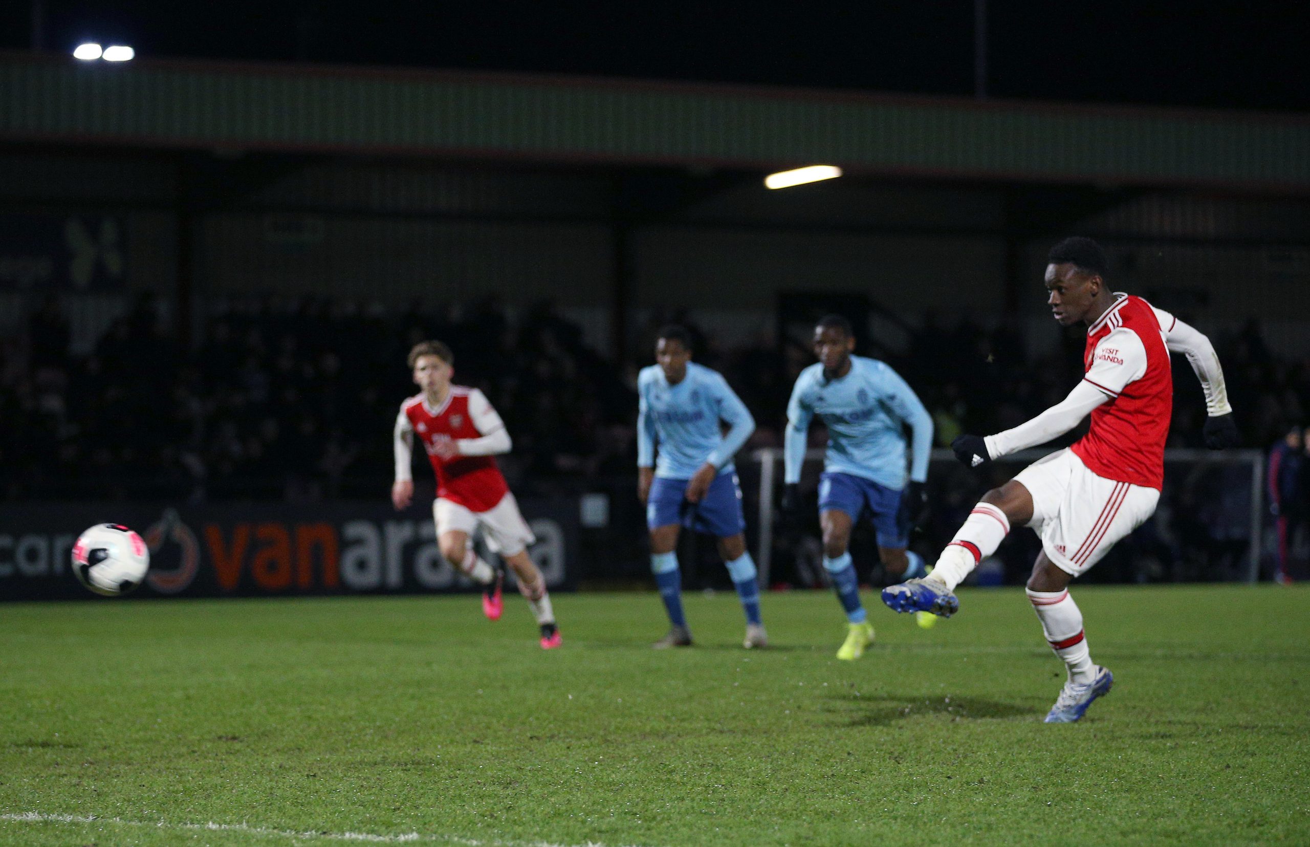 BOREHAMWOOD, ENGLAND - MARCH 03: Folarin Balogun of Arsenal FC scores his sides third goal from the penalty spot during the Premier League Internat...