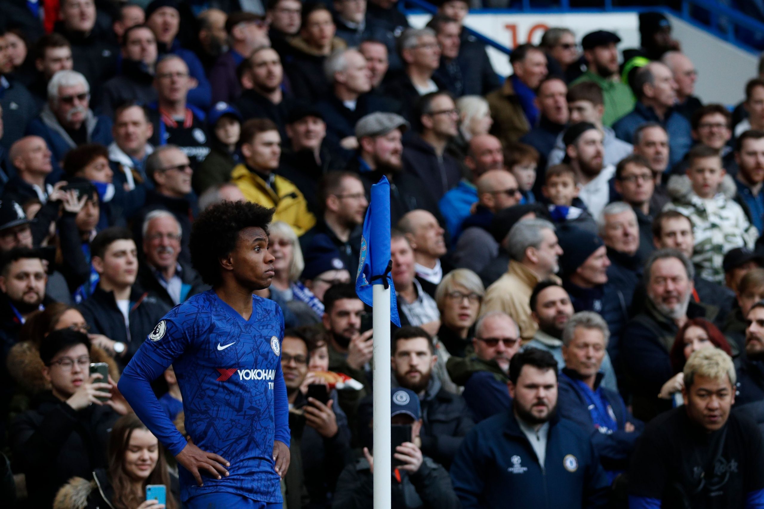 Chelsea's Brazilian midfielder Willian waits to take a corner kick during the English Premier League football match between Chelsea and Everton at ...