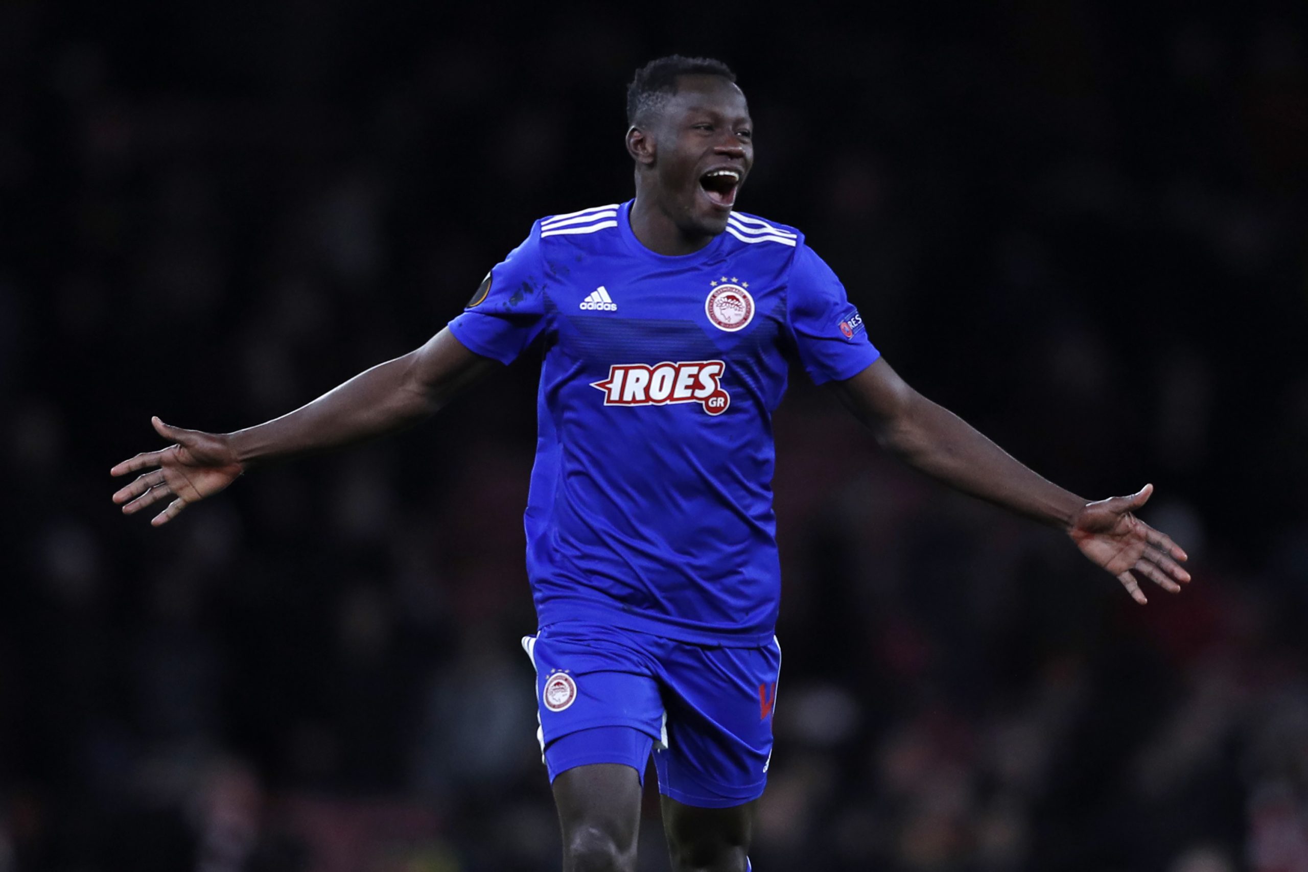 Olympiakos' Guinean midfielder Mohamed Mady Camara celebrates on the pitch after the UEFA Europa league round of 32 second leg football match betwe...
