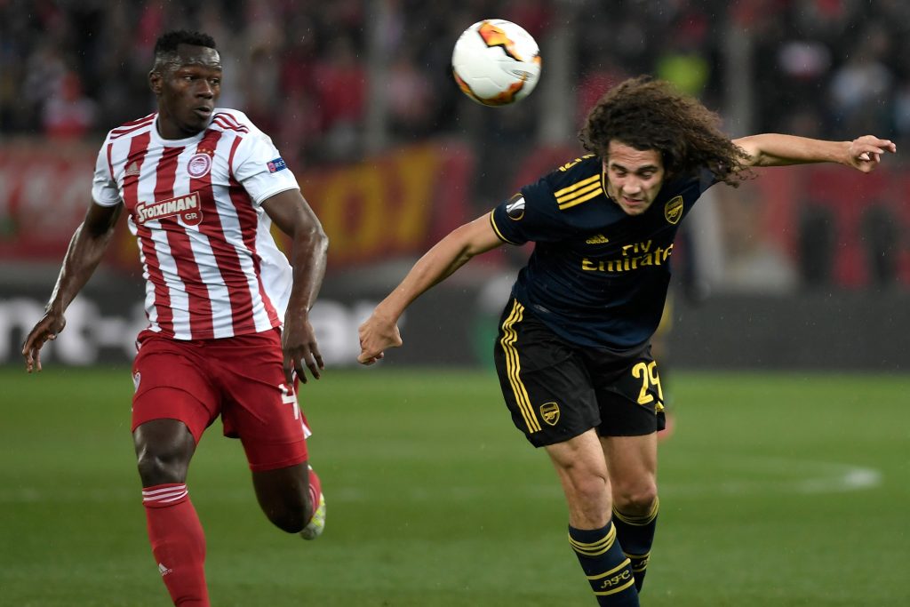 Arsenal's French midfielder Matteo Guendouzi (R) vies with Olympiakos' Guinean midfielder Mohamed Mady Camara (L) during the UEFA Europa League round of 32 first leg football match between Olympiakos and Arsenal at the Karaiskakis Stadium in Piraeus, near Athens, on February 20, 2020. (Photo by LOUISA GOULIAMAKI / AFP via Getty Images)