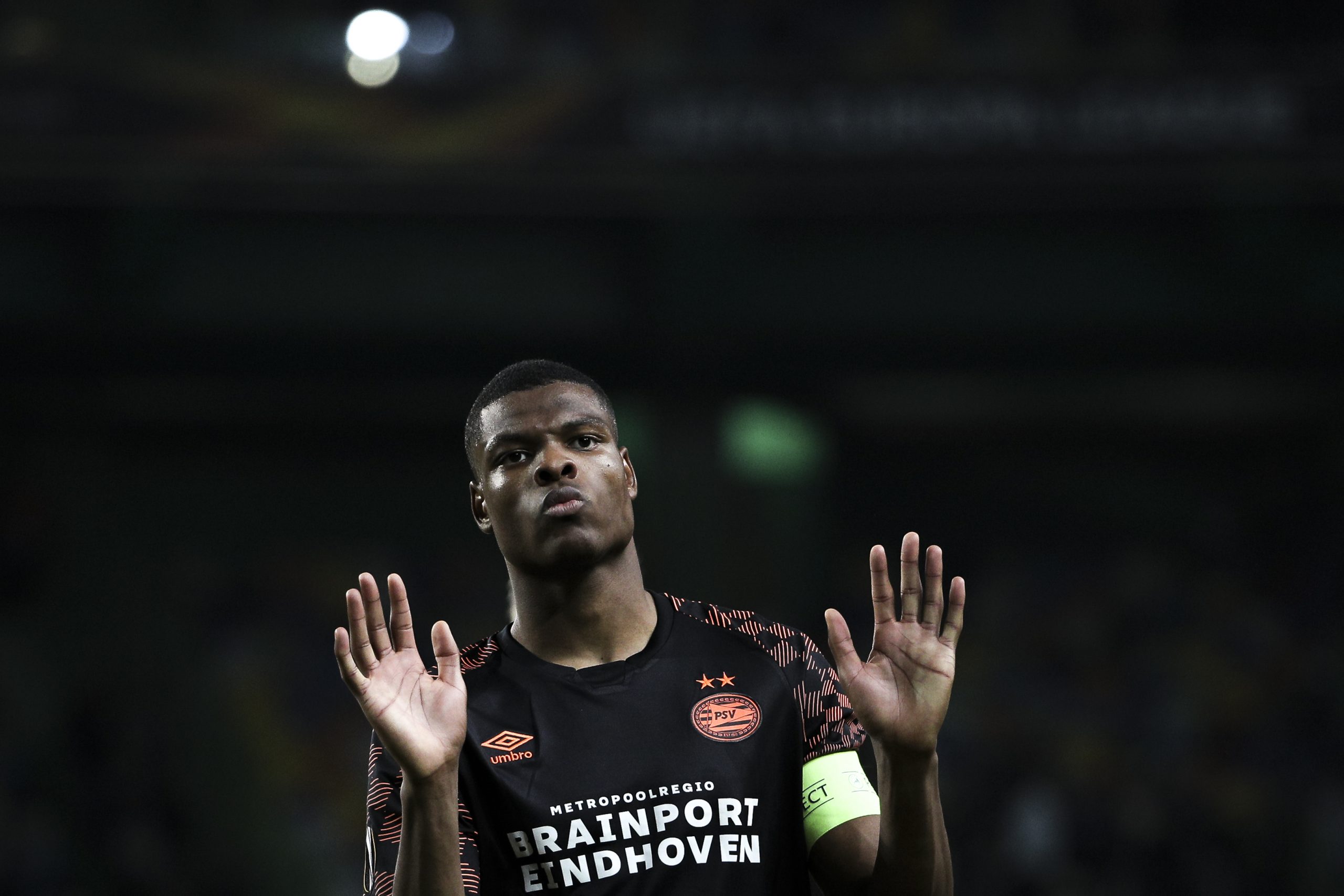 PSV Eindhoven's Dutch defender Denzel Dumfries acknowledges supporters at the end of the UEFA Europa League Group D football match between Sporting...