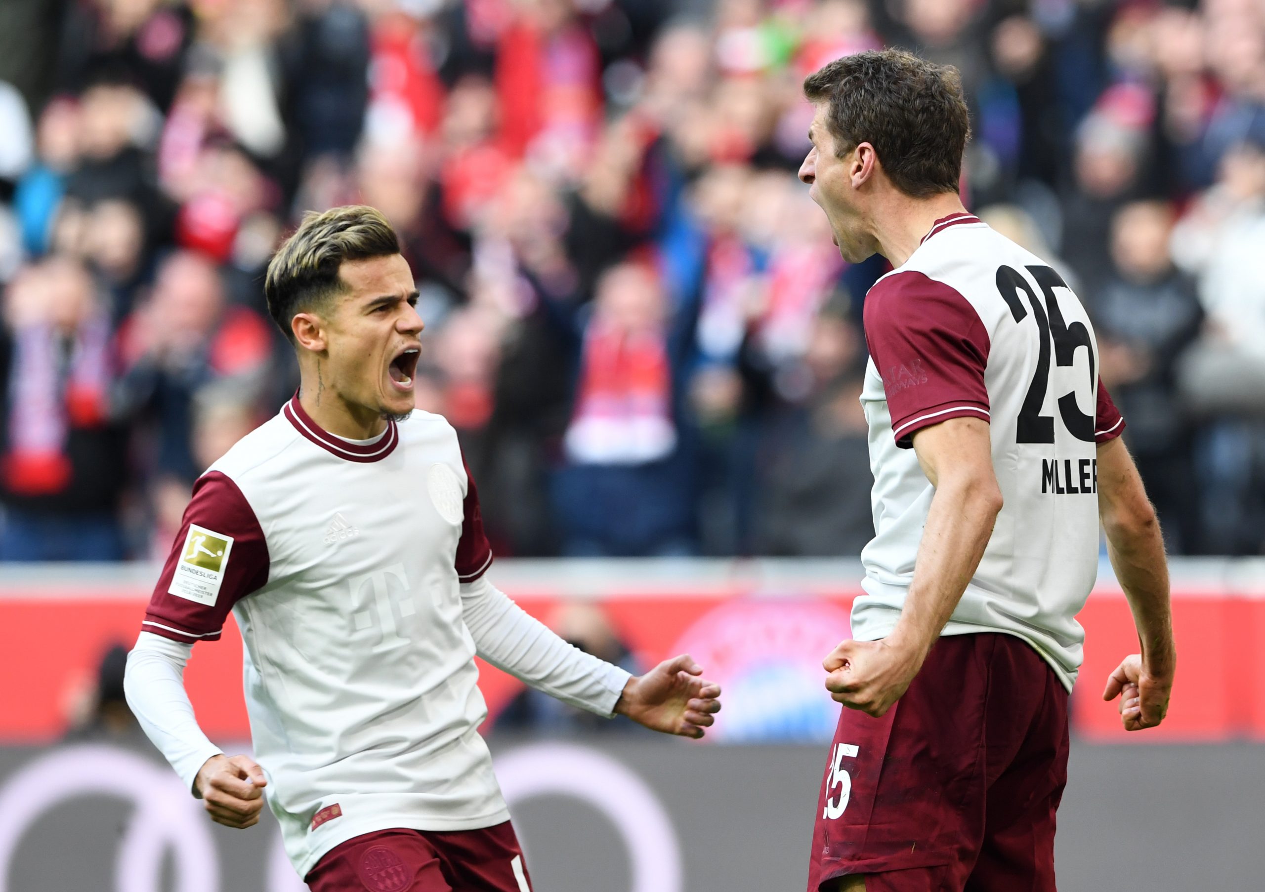 Bayern Munich's striker Thomas Mueller (R) and on-loan Bayern Munich midfielder Philippe Coutinho (L). Photo during the Bundesliga match between FC...