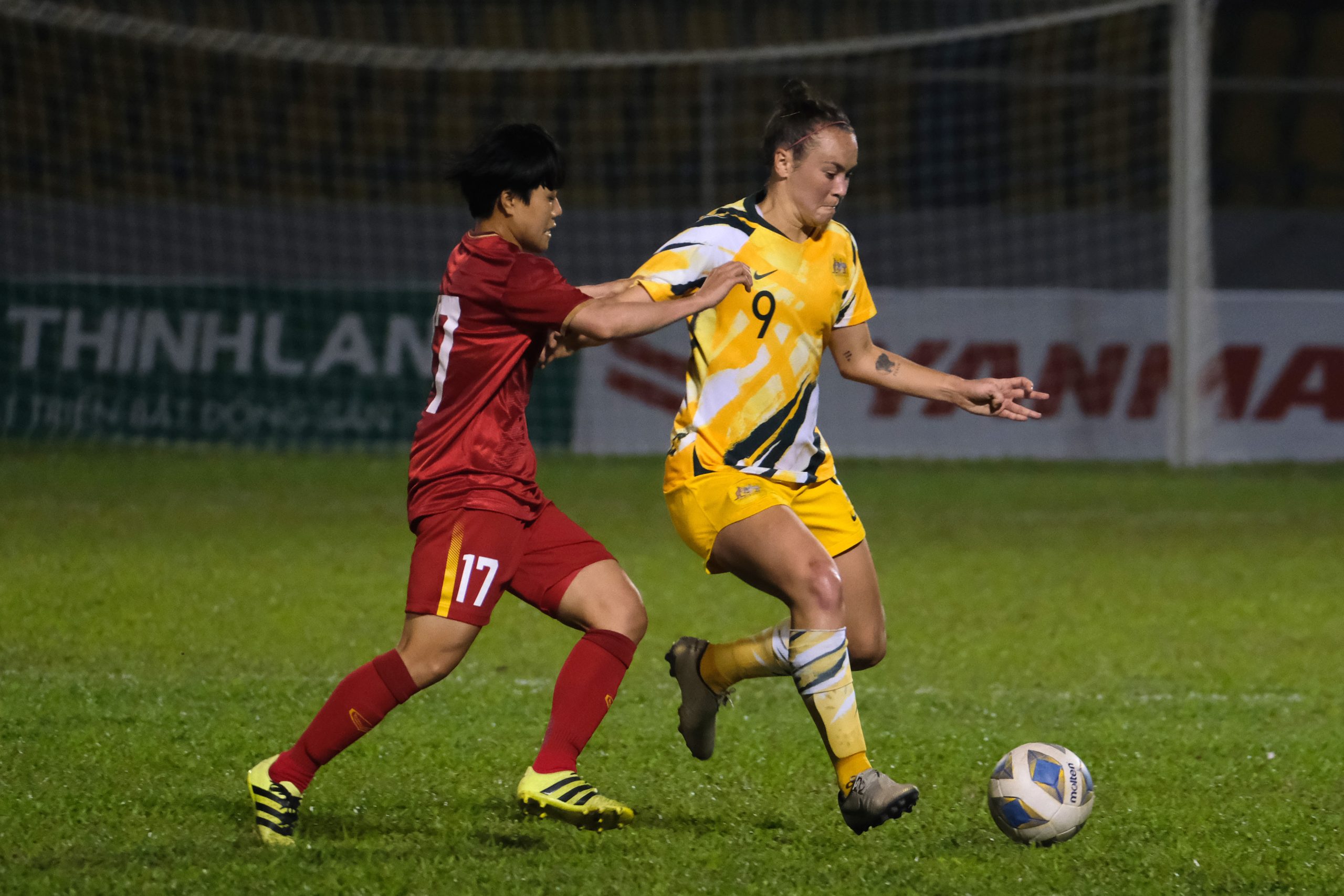 CAM PHA, VIETNAM - MARCH 11: Caitlin Foord of Australia controls the ball under pressure of Tran Thi Phuong Thao of Vietnam during the Women's Olympic Football Tournament Play-Off 2nd Leg between Vietnam and Australian Matildas at Cam Pha Stadium on March 11, 2020 in Cam Pha, Vietnam. (Photo by Linh Pham/Getty Images)