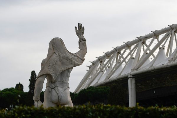 A photo taken on March 17, 2020 shows the Olympic stadium in Rome, with a statue from the Marbles stadium (Stadio dei Marmi) in foreground. - The E...