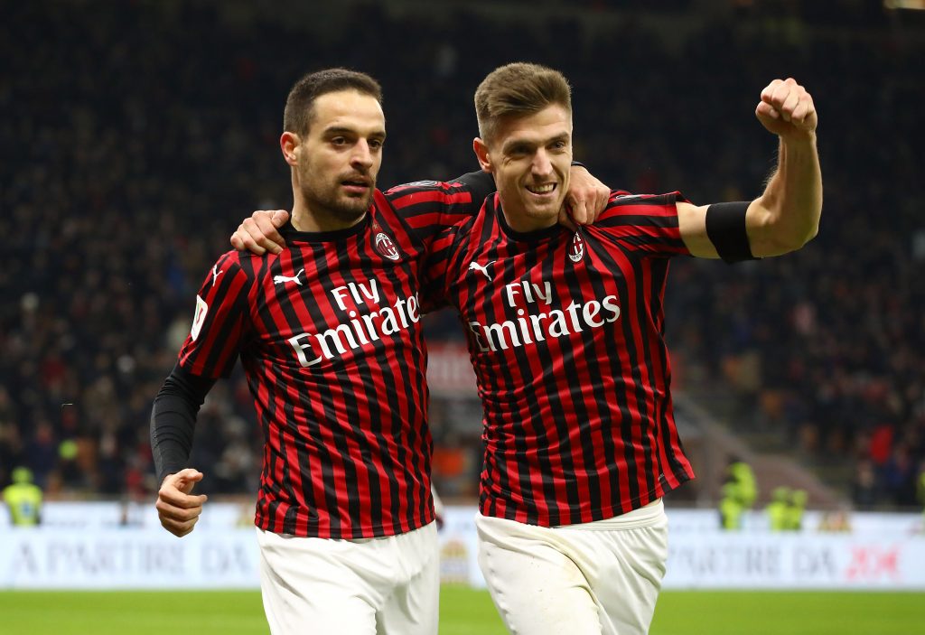 MILAN, ITALY - JANUARY 28:  Giacomo Bonaventura (L) of AC Milan celebrates with his team-mate Krzysztof Piatek (R) after scoring the opening goal during the Coppa Italia Quarter Final match between AC Milan and Torino at San Siro on January 28, 2020 in Milan, Italy.  (Photo by Marco Luzzani/Getty Images)