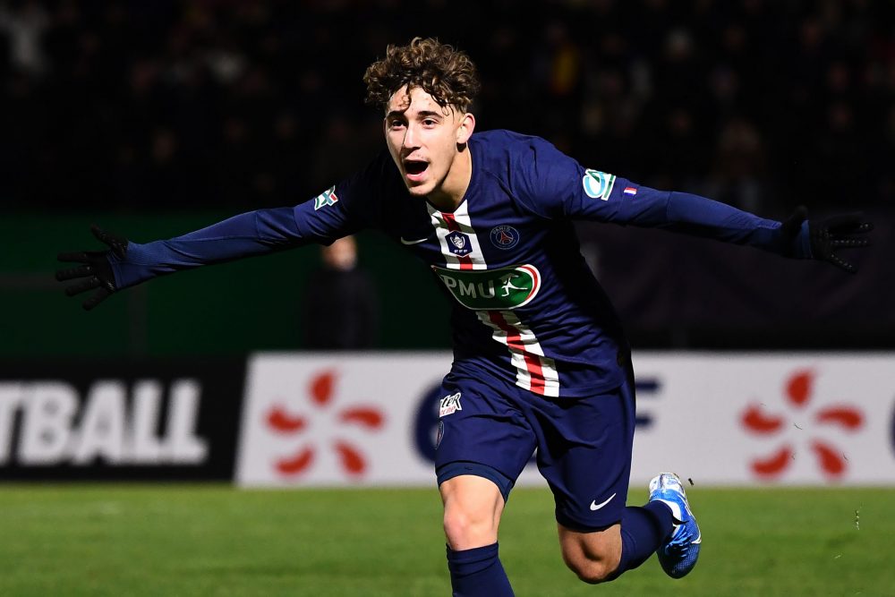 Paris Saint-Germain's French midfielder Adil Aouchiche celebrates after scoring a goal during the French Cup football match between Linas-Montlhery...