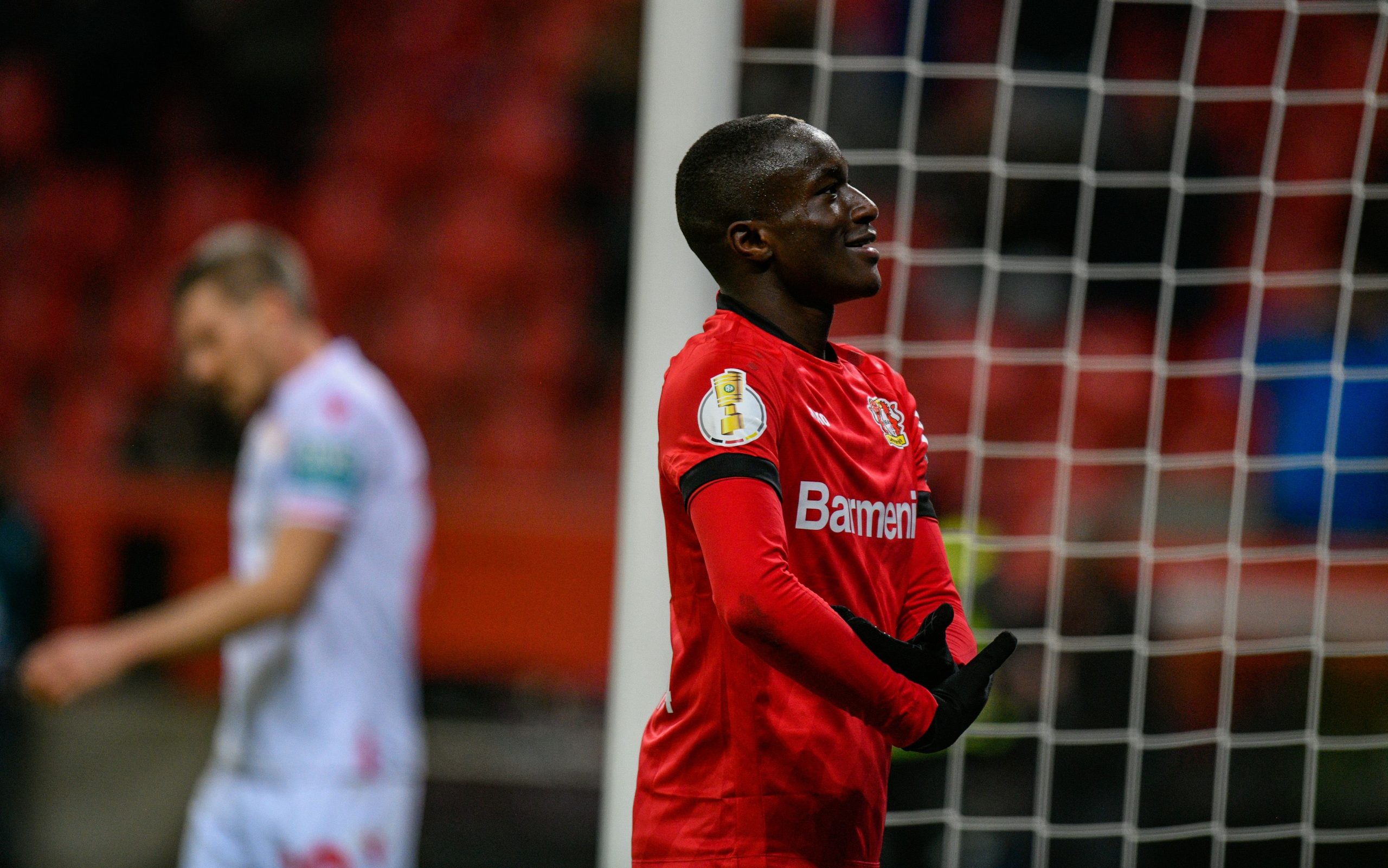 Leverkusen's French midfielder Moussa Diaby celebrate scoring the 3-1 goal during the German Cup (DFB Pokal) quarter-final football match Bayer Lev...