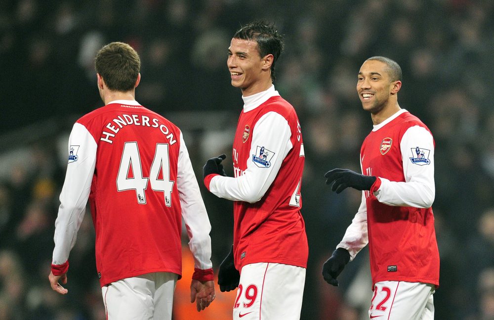 Arsenal's French defender Gael Clichy (R) celebrates scoring the fifth goal during their FA Cup fifth round replay football match against Leyton Or...