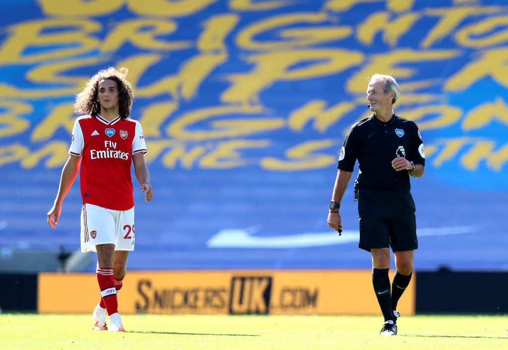 "Ridiculous": Arsenal fans rage at Atkinson decisions 2 BRIGHTON, ENGLAND - JUNE 20: Referee Martin Atkinson speaks to Matteo Guendouzi of Arsenal during the Premier League match between Brighton & Hove Albion and Arsenal FC at American Express Community Stadium on June 20, 2020 in Brighton, England. Football Stadiums around Europe remain empty due to the Coronavirus Pandemic as Government social distancing laws prohibit fans inside venues resulting in all fixtures being played behind closed doors. (Photo by Gareth Fuller/Pool via Getty Images)