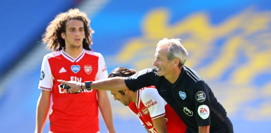 BRIGHTON, ENGLAND - JUNE 20: Referee Martin Atkinson awards a freekick to Arsenal during the Premier League match between Brighton & Hove Albion and Arsenal FC at American Express Community Stadium on June 20, 2020 in Brighton, England. (Photo by Richard Heathcote/Getty Images)