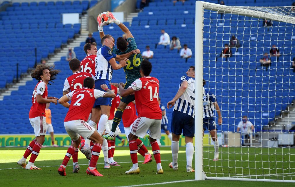 Assessed: Arsenal goalkeeper options with Bernd Leno out 2 Arsenal's Argentinian goalkeeper Emiliano Martinez catches the ball despite pressure from Brighton's English defender Dan Burn during the English Premier League football match between Brighton and Hove Albion and Arsenal at the American Express Community Stadium in Brighton, southern England on June 20, 2020. (Photo by Mike Hewitt / POOL / AFP) / RESTRICTED TO EDITORIAL USE. No use with unauthorized audio, video, data, fixture lists, club/league logos or 'live' services. Online in-match use limited to 120 images. An additional 40 images may be used in extra time. No video emulation. Social media in-match use limited to 120 images. An additional 40 images may be used in extra time. No use in betting publications, games or single club/league/player publications. / (Photo by MIKE HEWITT/POOL/AFP via Getty Images)