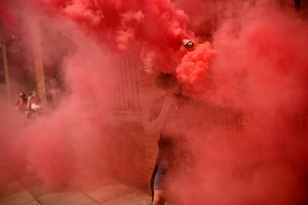 Liverpool fans celebrate victory outside Anfield stadium in Liverpool, north west England on June 26, 2020 after Liverpool FC sealed the Premier Le...