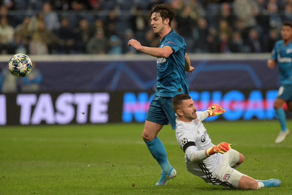 Zenit St. Petersburg's Iranian forward Sardar Azmoun challenges Lyon's Portuguese goalkeeper Anthony Lopes during the UEFA Champions League group G football match between Zenit and Lyon at the Gazprom Arena in Saint Petersburg on November 27, 2019. (Photo by Olga MALTSEVA / AFP) 