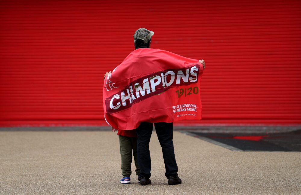 LIVERPOOL, ENGLAND - JUNE 26: A fan looks on after Liverpool confirmed as Premier League Champions at Anfield on June 26, 2020 in Liverpool, England. Liverpool claim their first championship in 30 years. (Photo by Jan Kruger/Getty Images)