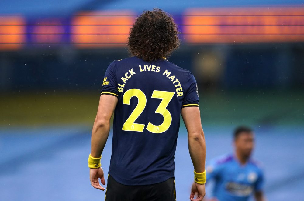 MANCHESTER, ENGLAND - JUNE 17: Black Lives Matter slogan is seen on the back of for David Luiz of Arsenal as he looks on during the Premier League ...