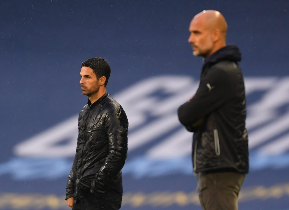 MANCHESTER, ENGLAND - JUNE 17: Mikel Arteta, Manager of Arsenal and Pep Guardiola, Manager of Manchester City look on during the Premier League mat...