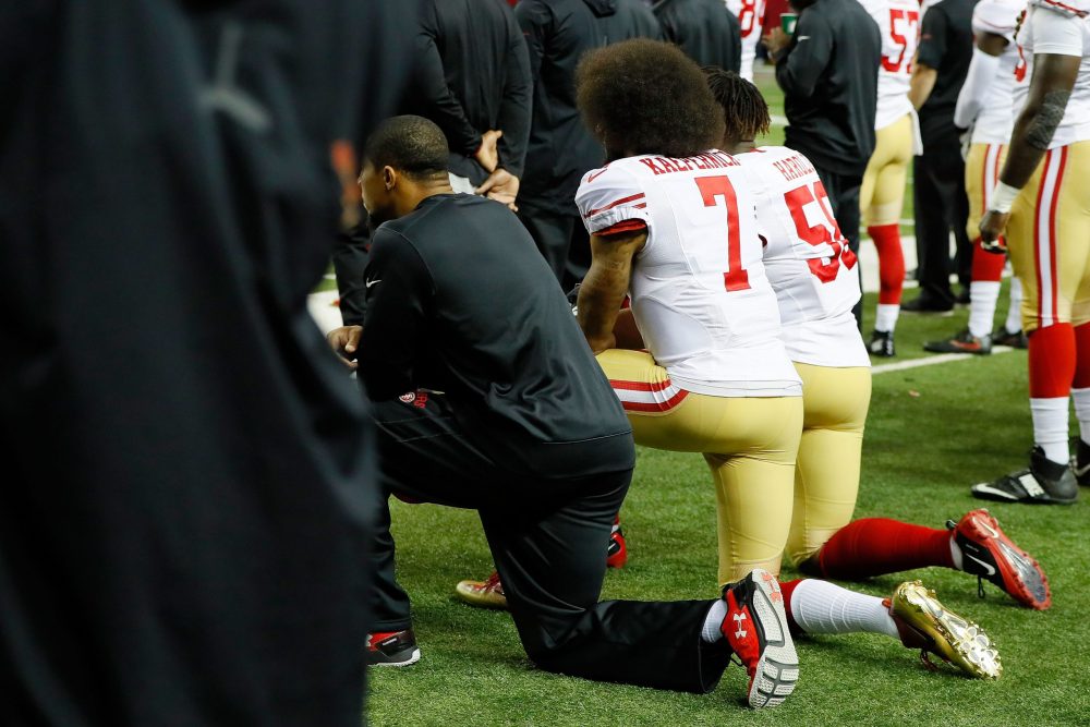 Arsenal and Manchester United owners refuse to apologise 2 ATLANTA, GA - DECEMBER 18: Colin Kaepernick #7 of the San Francisco 49ers and Eli Harold #58 kneel during the National Anthem prior to the game against the Atlanta Falcons at the Georgia Dome on December 18, 2016 in Atlanta, Georgia. (Photo by Kevin C. Cox/Getty Images)