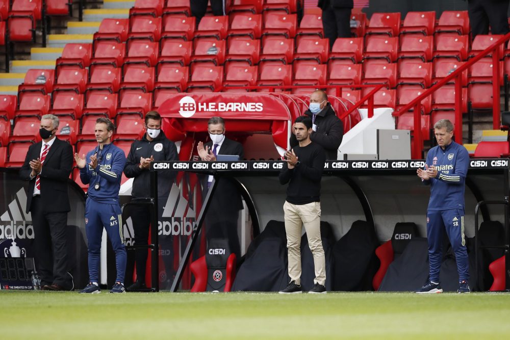 SHEFFIELD, ENGLAND - JUNE 28: Mikel Arteta, Manager of Arsenal and surrounding staff takes part in the minutes applause in support of the NHS and K...