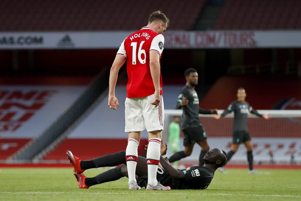 Arsenal transfer window roundup: All signings, departures and loans 3 LONDON, ENGLAND - JULY 15: Sadio Mane of Liverpool clashes with Rob Holding of Arsenal during the Premier League match between Arsenal FC and Liverpool FC at Emirates Stadium on July 15, 2020 in London, England. Football Stadiums around Europe remain empty due to the Coronavirus Pandemic as Government social distancing laws prohibit fans inside venues resulting in all fixtures being played behind closed doors. (Photo by Paul Childs/Pool via Getty Images)