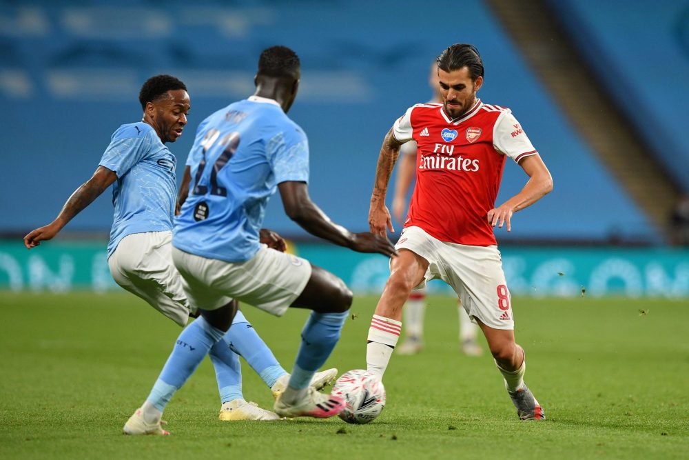 LONDON, ENGLAND - JULY 18: Dani Ceballos of Arsenal battles for possession with Raheem Sterling and Benjamin Mendy of Manchester City during the FA...