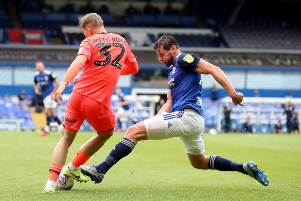 BIRMINGHAM, ENGLAND - JULY 01: Emile Smith Rowe of Huddersfield Town is challenged by Lukas Jutkiewicz of Birmingham City during the Sky Bet Champi...